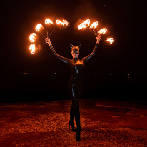 Catwoman with fire fans