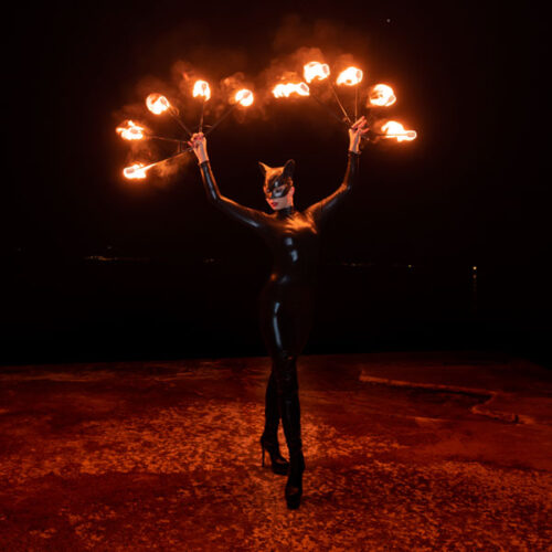 Catwoman with fire fans