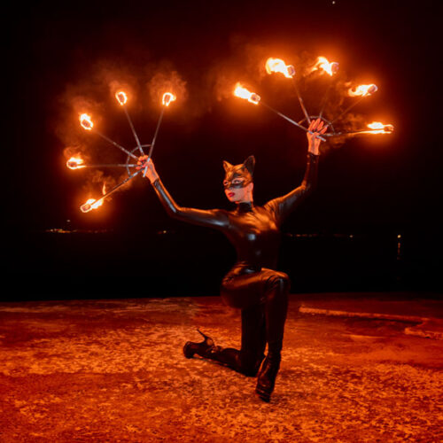 Catwoman with fire fans